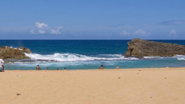 From San Juan: Cave of the Taino Indian Trek and Beach Tour